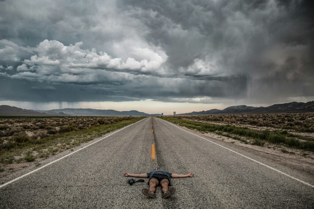 photography person lying on road